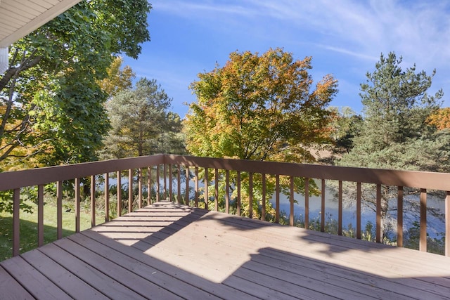 wooden deck featuring a water view