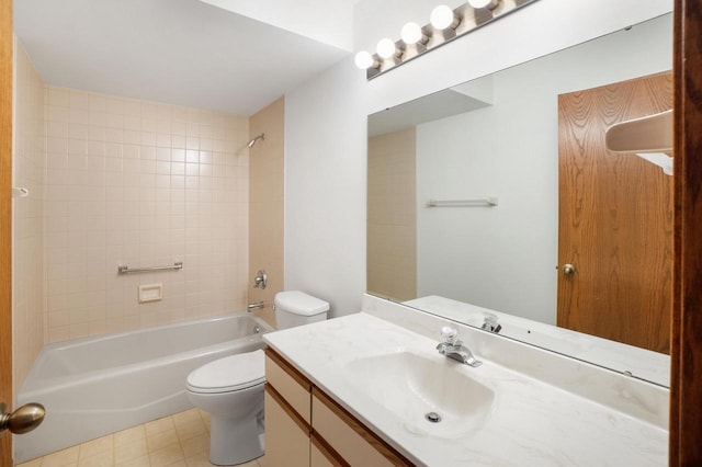 full bathroom featuring vanity, toilet, and tiled shower / bath combo