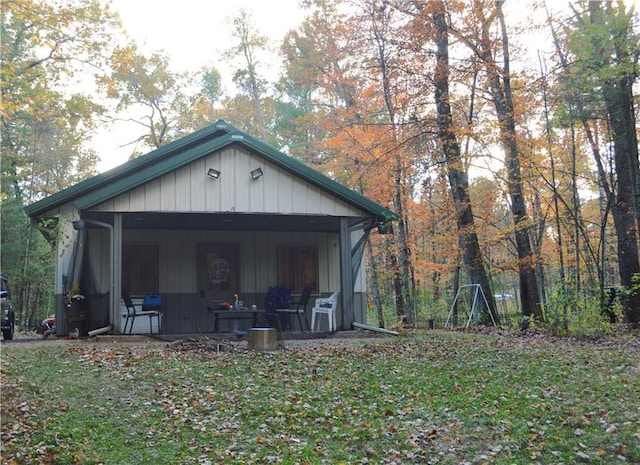 view of outdoor structure featuring covered porch