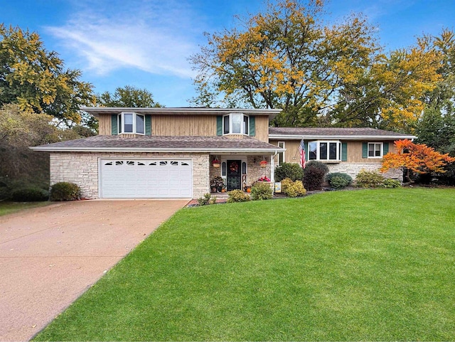 split level home featuring a front yard and a garage