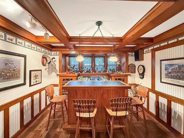 bar with beam ceiling, coffered ceiling, dark hardwood / wood-style flooring, and pendant lighting