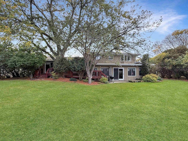 view of yard with a wooden deck