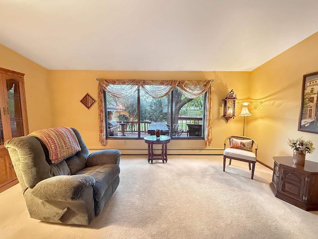 living area with carpet flooring and a baseboard heating unit