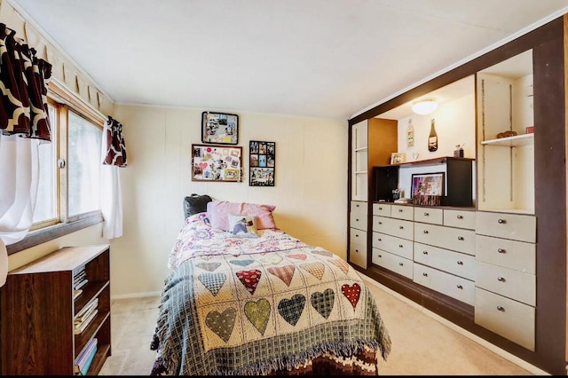 bedroom featuring light carpet