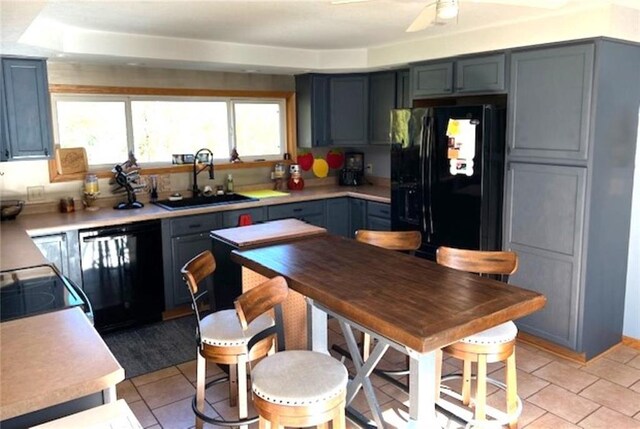 345 Old County D, Shell Lake, WI 54871 - kitchen featuring a sink, black appliances, ceiling fan, light countertops, and light tile patterned floors