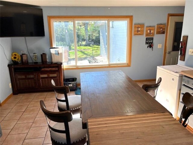 345 Old County D, Shell Lake, WI 54871 - dining room featuring light tile patterned flooring and baseboards