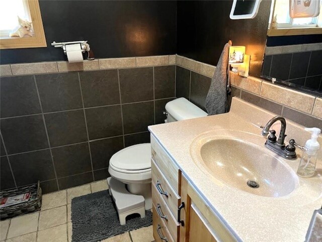 345 Old County D, Shell Lake, WI 54871 - bathroom featuring tile walls, tile patterned floors, vanity, and toilet