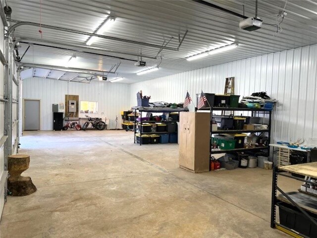 345 Old County D, Shell Lake, WI 54871 - garage featuring a garage door opener, a workshop area, and electric panel