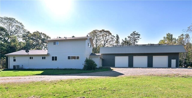 345 Old County D, Shell Lake, WI 54871 - exterior space with a front lawn, an outdoor structure, and central AC