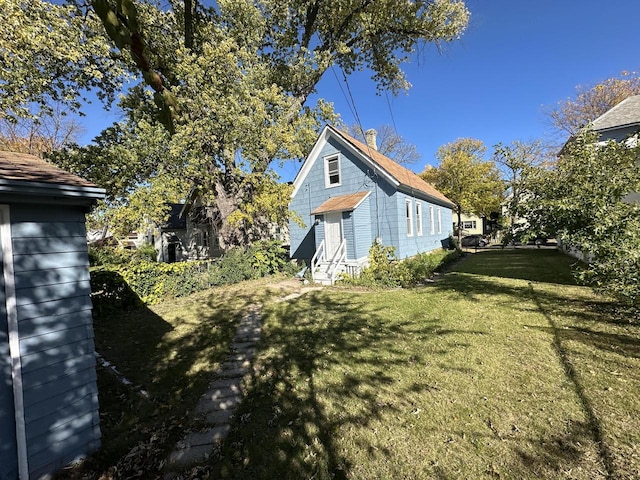 view of home's exterior featuring a lawn