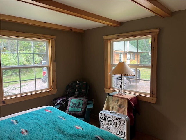 bedroom featuring beam ceiling