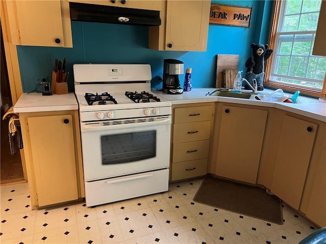 kitchen featuring white gas range