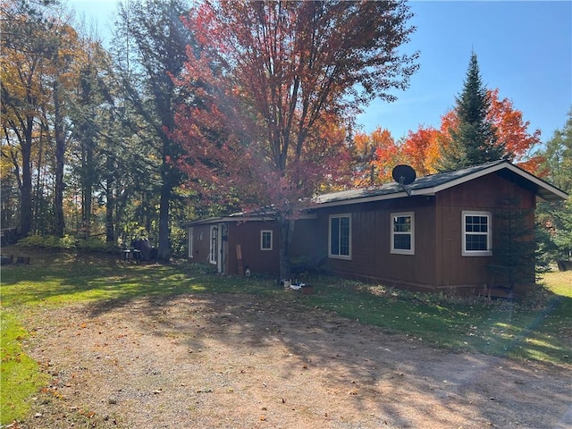 rear view of house with a lawn