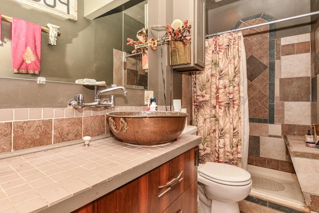 bathroom featuring toilet, vanity, and a shower with shower curtain