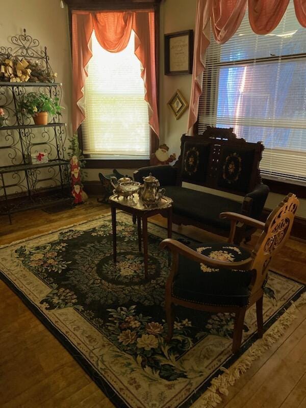 living area with hardwood / wood-style floors