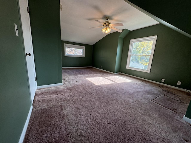 bonus room with ceiling fan, a healthy amount of sunlight, carpet flooring, and lofted ceiling