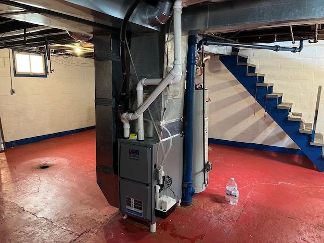 261 S Grant St, Adams, WI 53910 - basement with stairway, water heater, and heating unit
