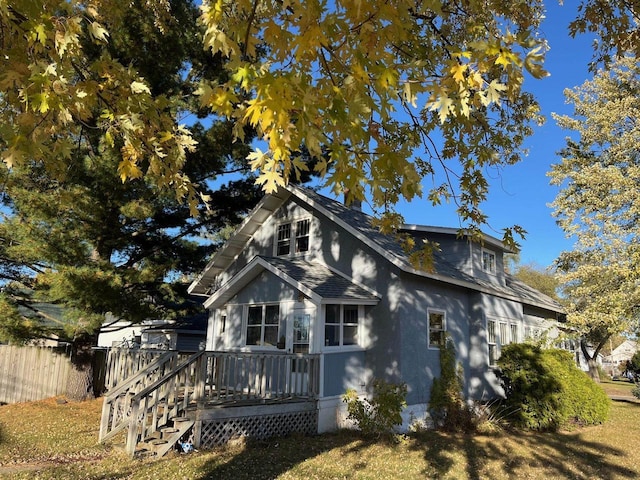 261 S Grant St, Adams, WI 53910 - view of side of home featuring a deck and roof with shingles