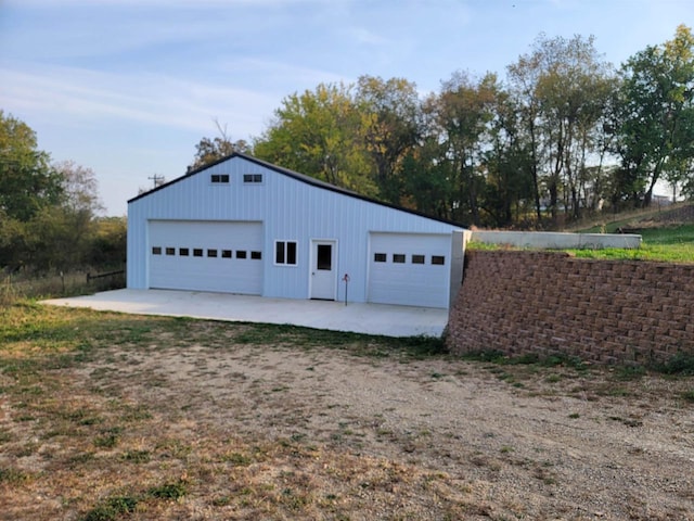 garage featuring wooden walls