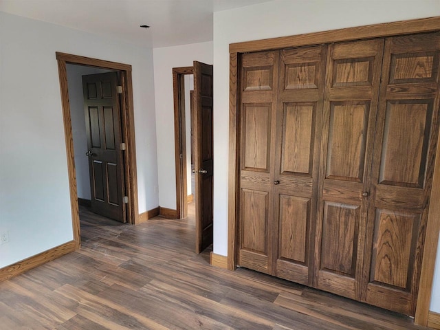 hallway with dark wood-type flooring