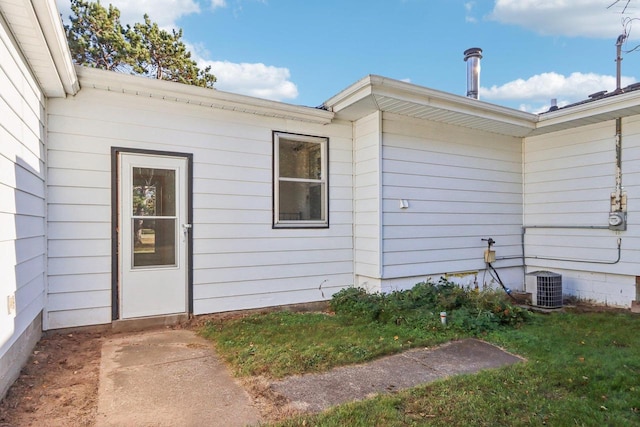 doorway to property with cooling unit