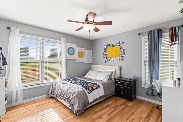 bedroom featuring ceiling fan and light hardwood / wood-style flooring