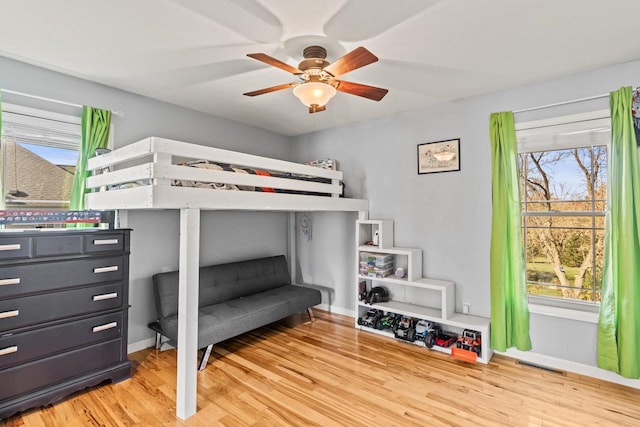 bedroom featuring hardwood / wood-style flooring and ceiling fan