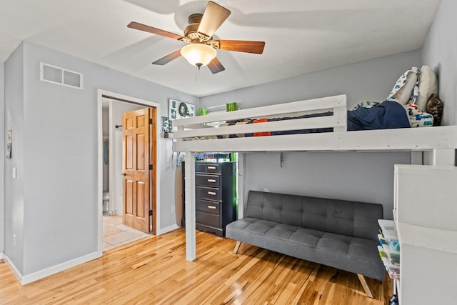 bedroom featuring ceiling fan and wood-type flooring