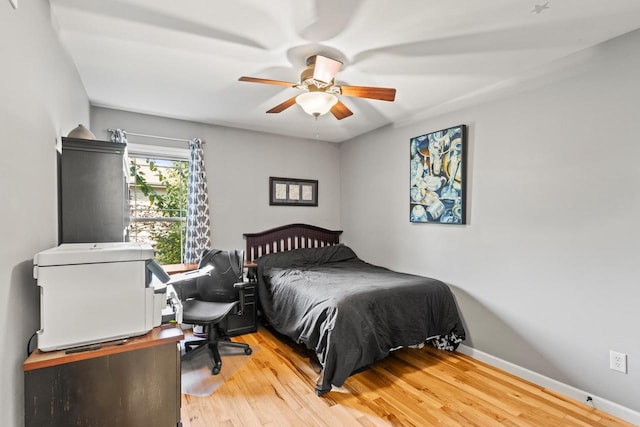 bedroom with wood-type flooring and ceiling fan