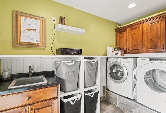 washroom featuring washer and dryer, tile patterned floors, cabinets, and sink