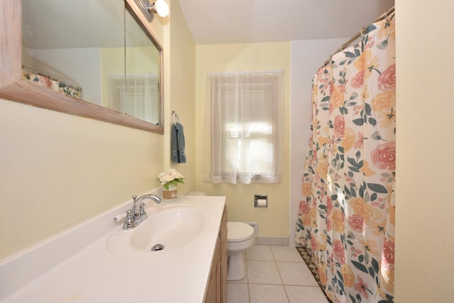 bathroom featuring vanity, toilet, tile patterned floors, and curtained shower