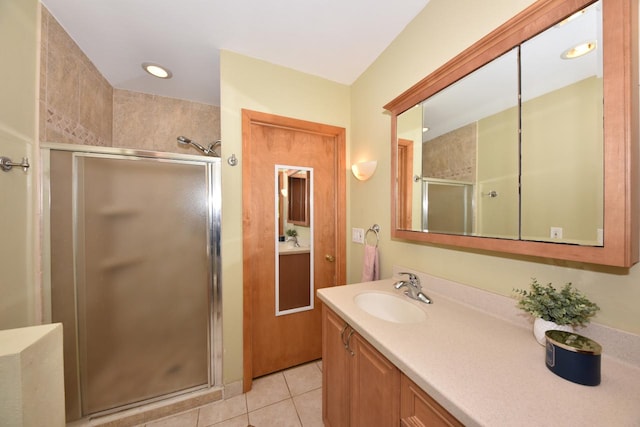 bathroom with vanity, tile patterned floors, and an enclosed shower