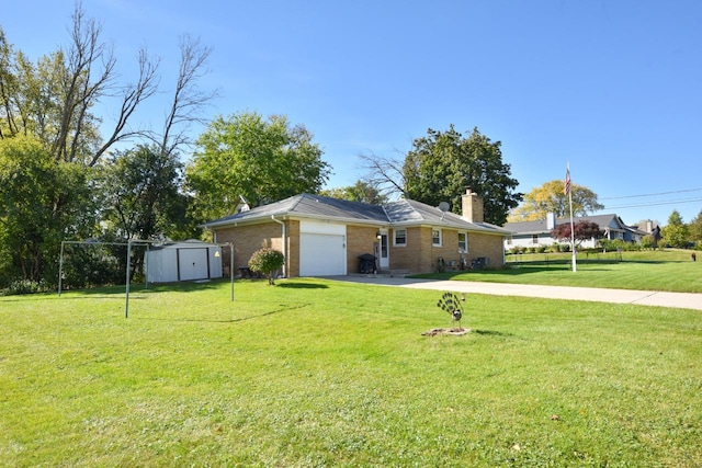 ranch-style house with a storage shed, a front yard, and a garage