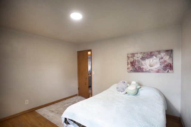 bedroom featuring wood-type flooring