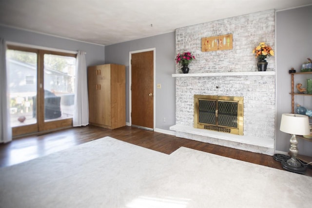 living room featuring a fireplace and dark hardwood / wood-style floors