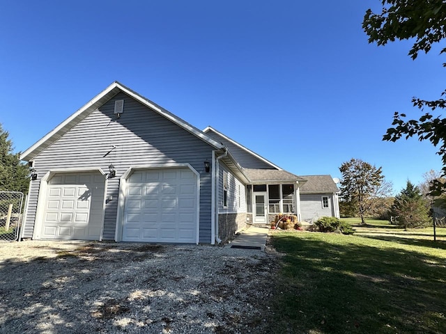 view of front of house with a front lawn and a garage