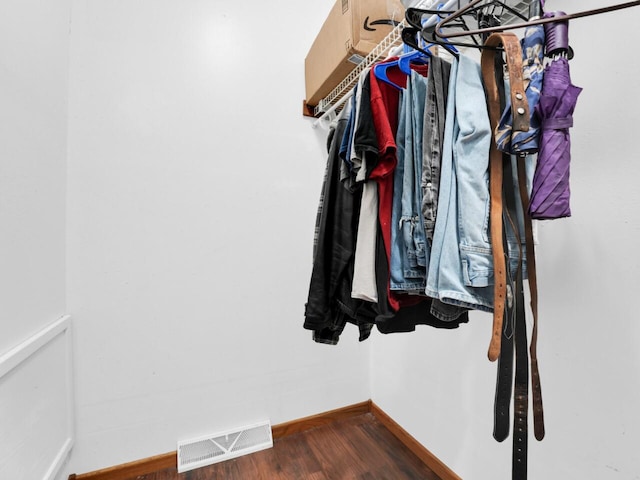 walk in closet featuring dark wood-type flooring