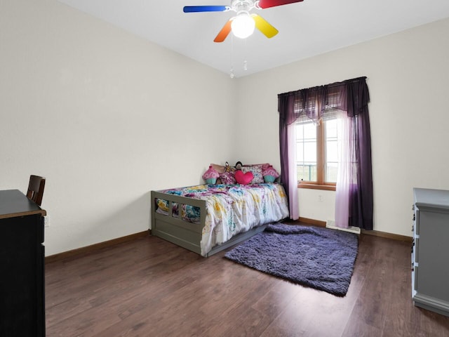 bedroom featuring dark wood-type flooring and ceiling fan