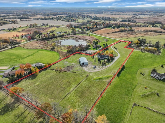 drone / aerial view with a rural view and a water view