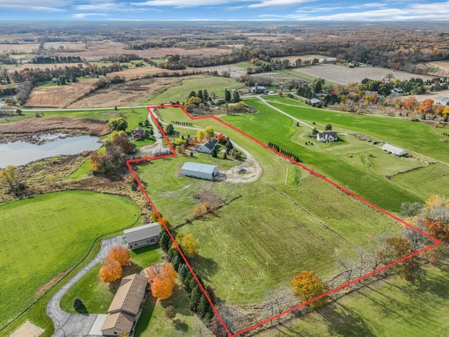 birds eye view of property featuring a rural view