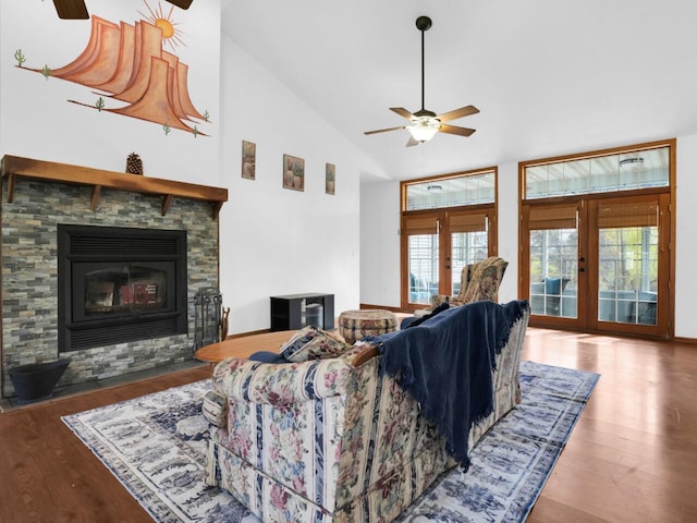 living room featuring french doors, hardwood / wood-style floors, ceiling fan, and high vaulted ceiling