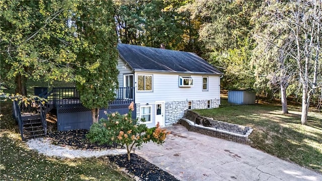 view of outbuilding featuring a yard