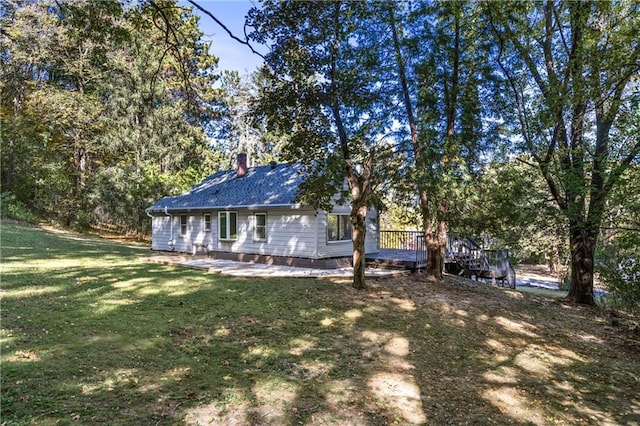 view of side of home featuring a yard