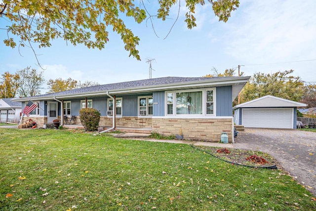 ranch-style home with an outbuilding, a garage, and a front yard