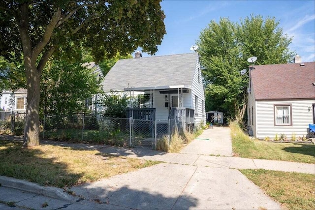 bungalow-style home featuring a front yard