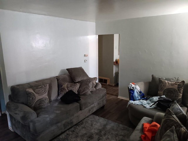 living room with dark hardwood / wood-style floors