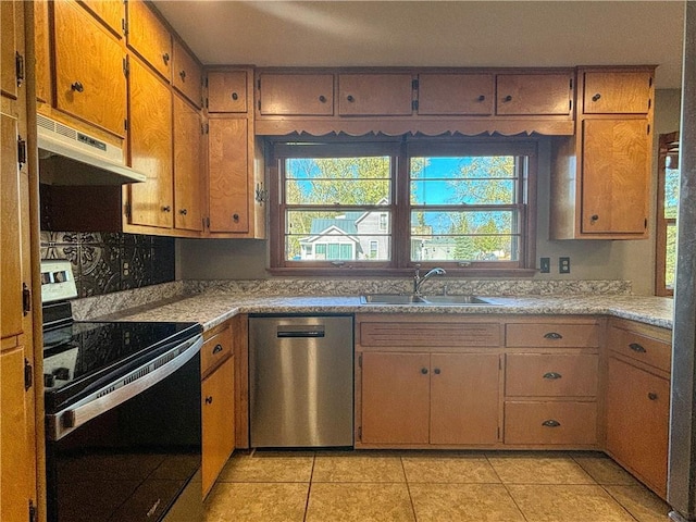 kitchen featuring sink, light tile patterned floors, and appliances with stainless steel finishes