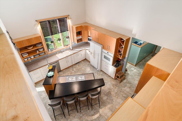 kitchen with white cabinetry and sink