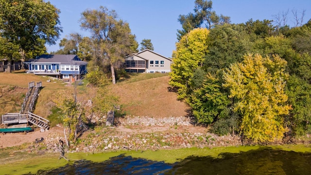 birds eye view of property with a water view