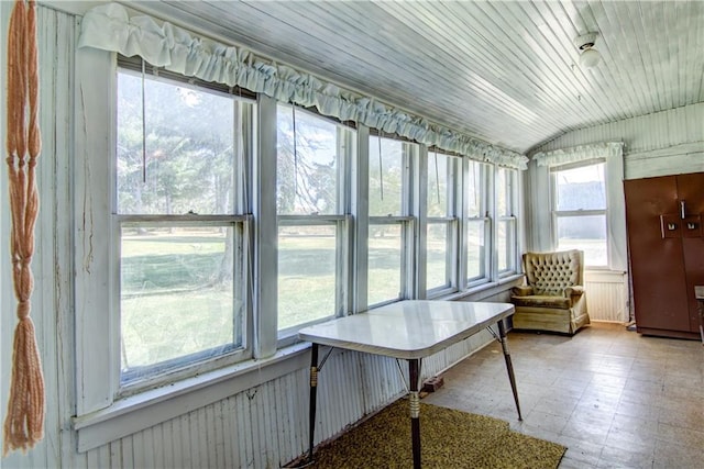 sunroom / solarium with lofted ceiling and wood ceiling